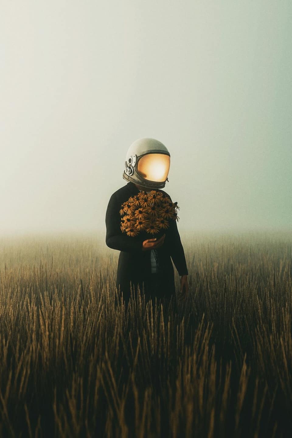 A lone figure in a foggy field, face hidden behind a helmet, holding a bouquet of flowers.